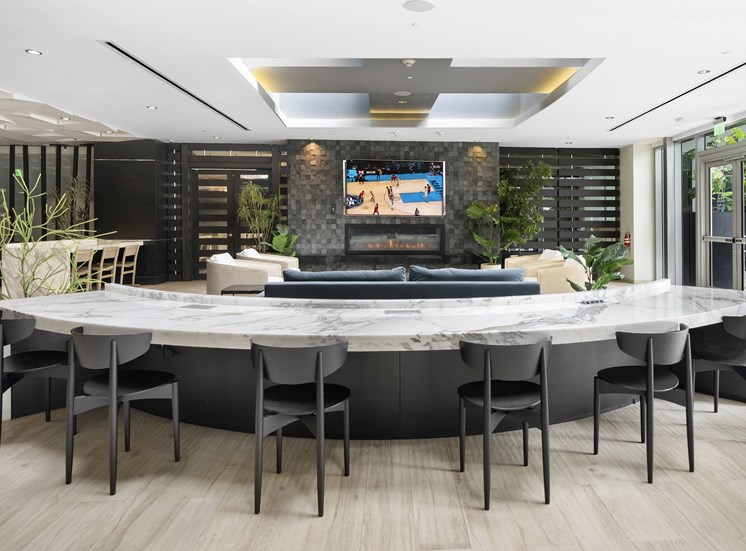 A modern conference room with a large table and chairs.